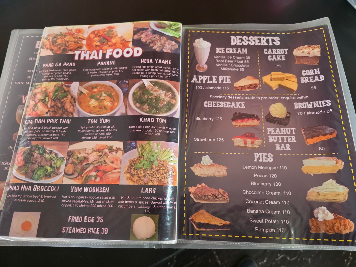 A Pattaya restaurant menu photographed by Danny Flight showing Thai dishes like phad ga prao and tom yum at 150 baht next to a dessert page with pies around 110 baht.